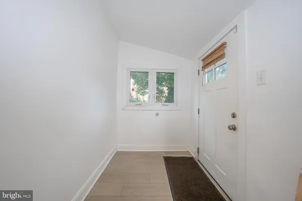 a view of an empty room and closet area