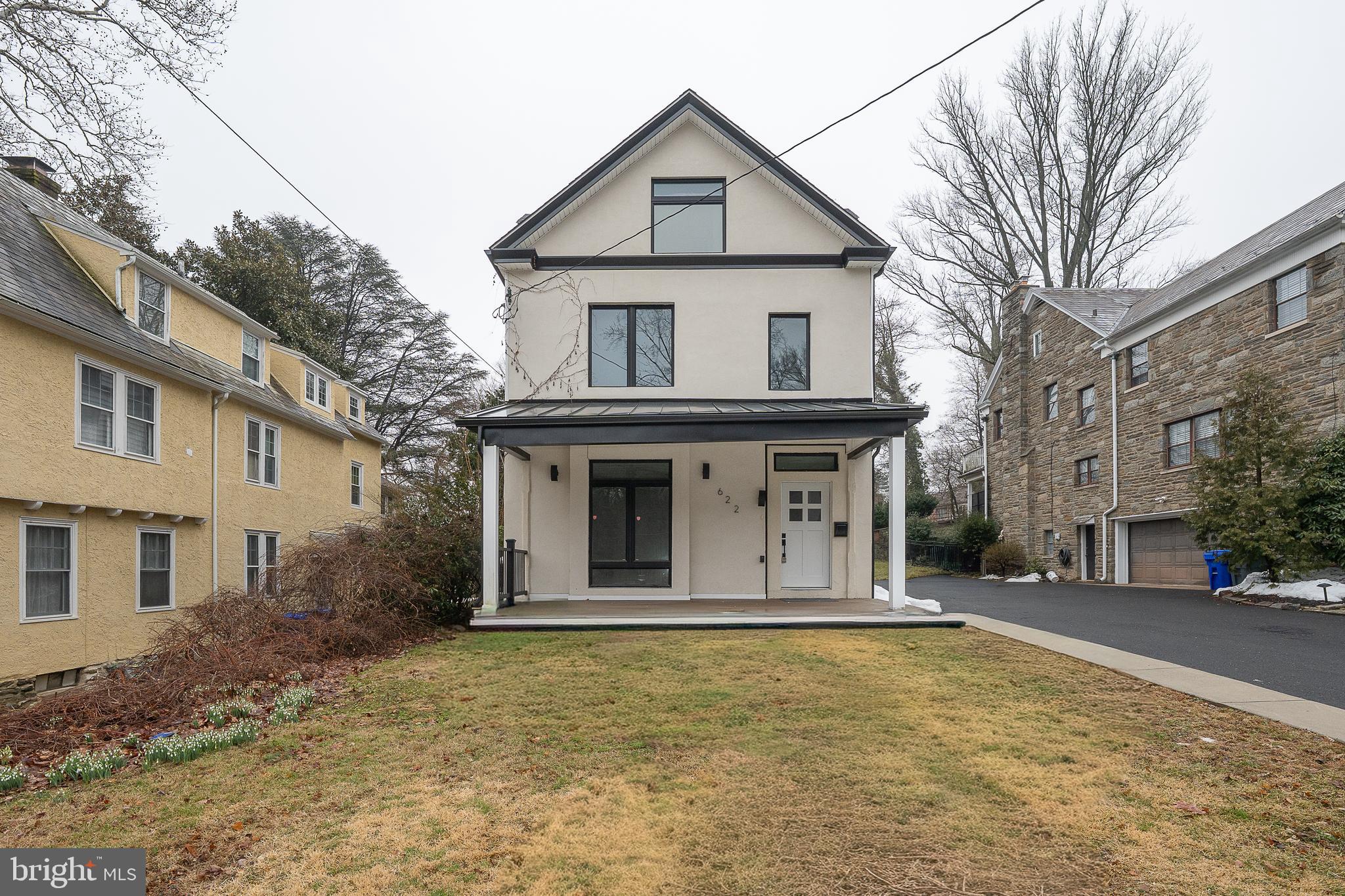 622 Spring Avenue Elkins Park, PA 19027 - Photo 3 of 65 a view of a white house with a large windows