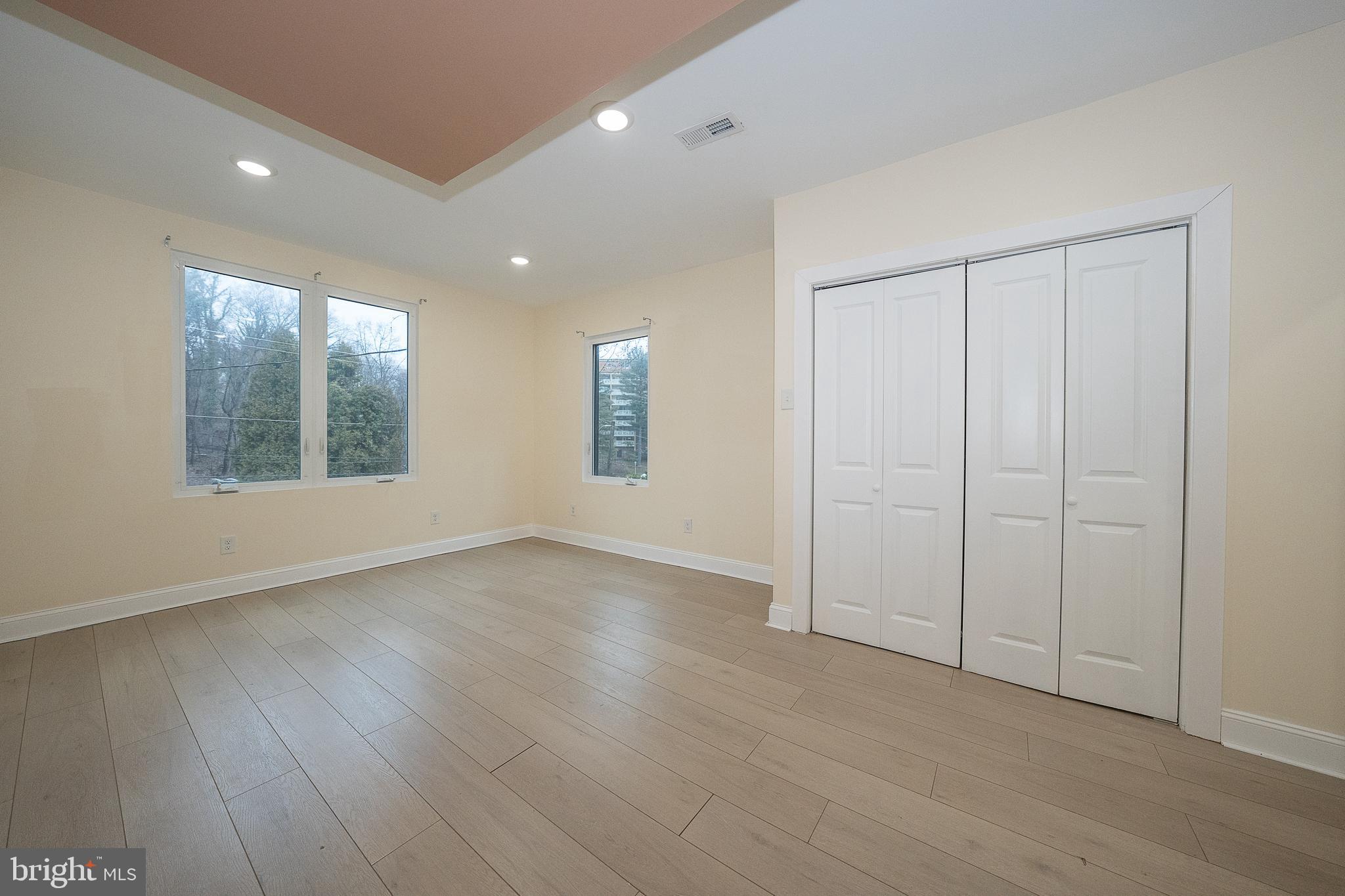 622 Spring Avenue Elkins Park, PA 19027 - Photo 31 of 65 an empty room with wooden floor and windows