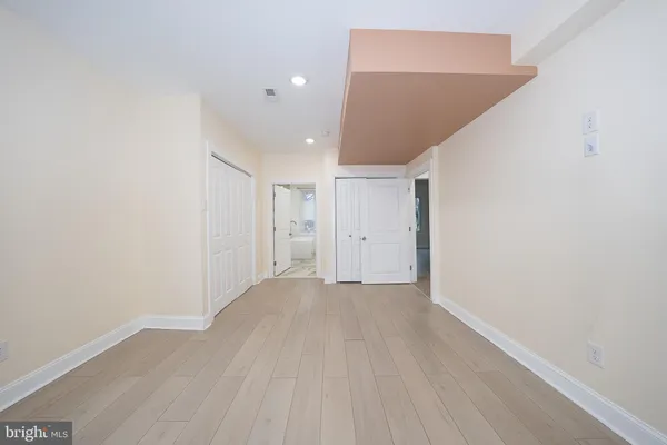 a bathroom with a glass shower door