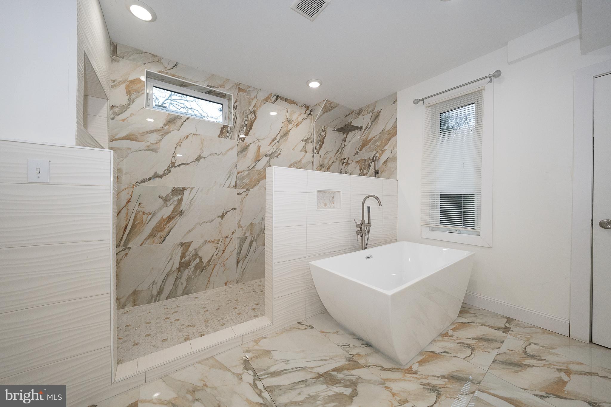 622 Spring Avenue Elkins Park, PA 19027 - Photo 37 of 65 a bathroom with a bathtub and shower