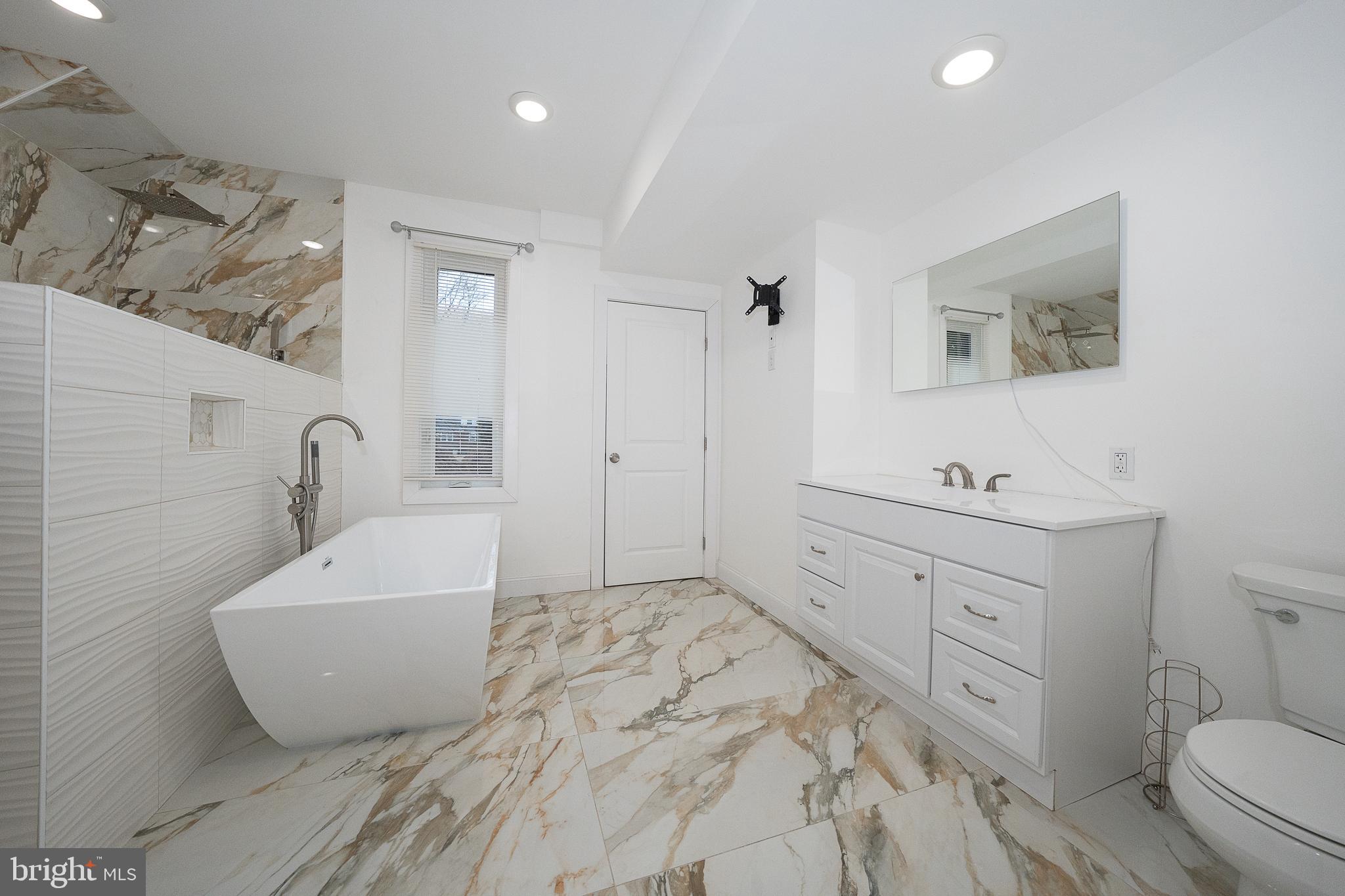 622 Spring Avenue Elkins Park, PA 19027 - Photo 39 of 65 a bathroom with a sink toilet and shower