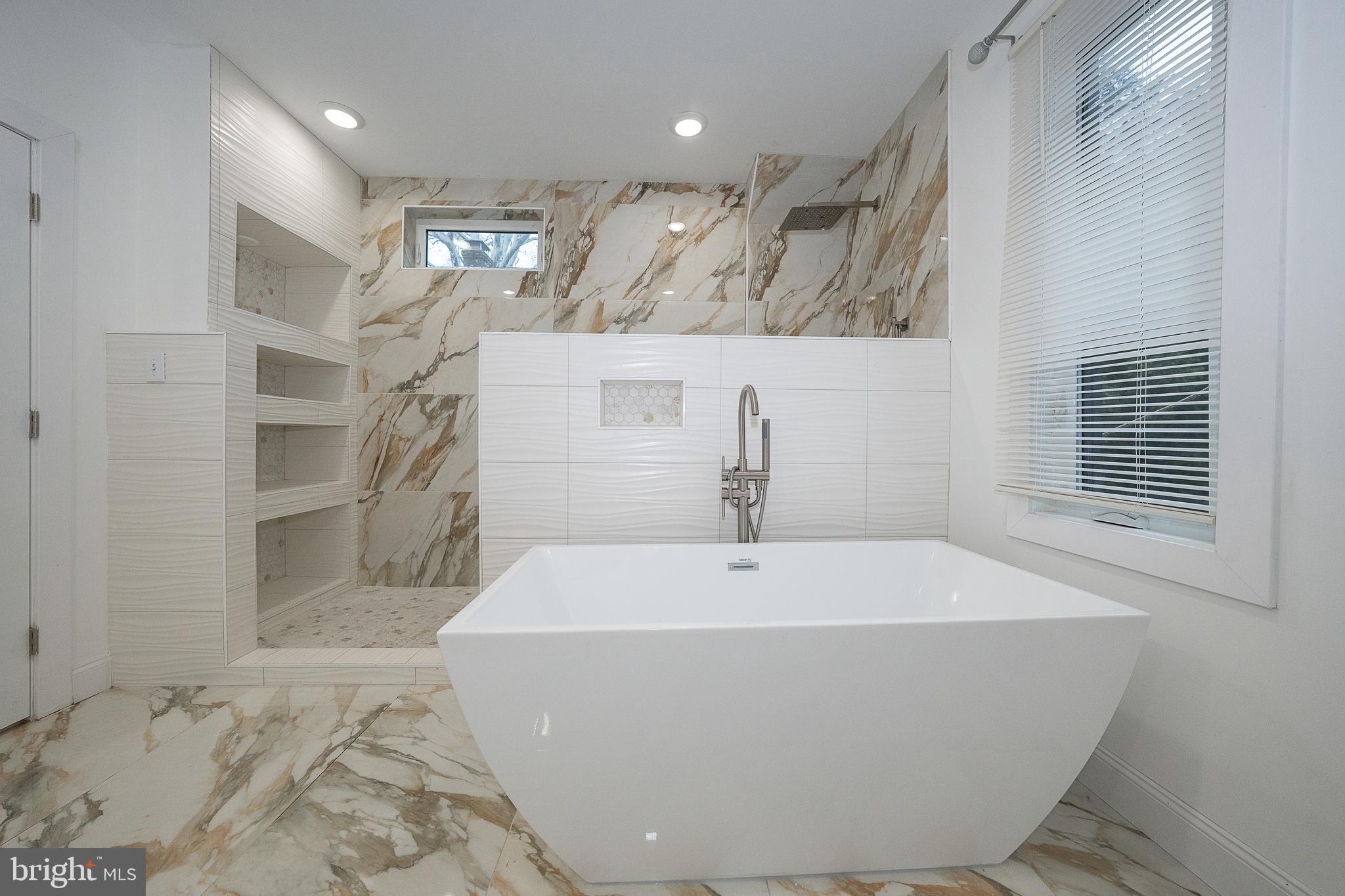 622 Spring Avenue Elkins Park, PA 19027 - Photo 40 of 65 a white bath tub sitting in a bathroom