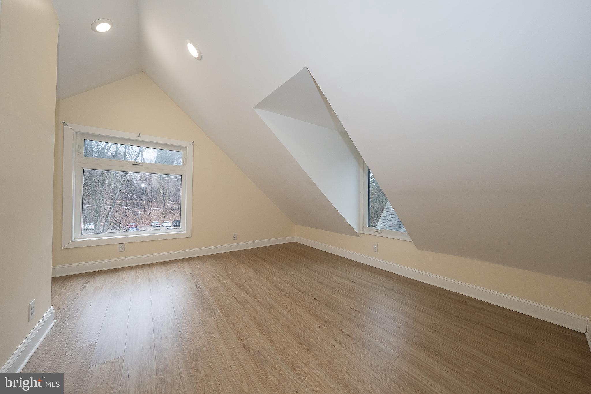 622 Spring Avenue Elkins Park, PA 19027 - Photo 46 of 65 an empty room with wooden floor and windows