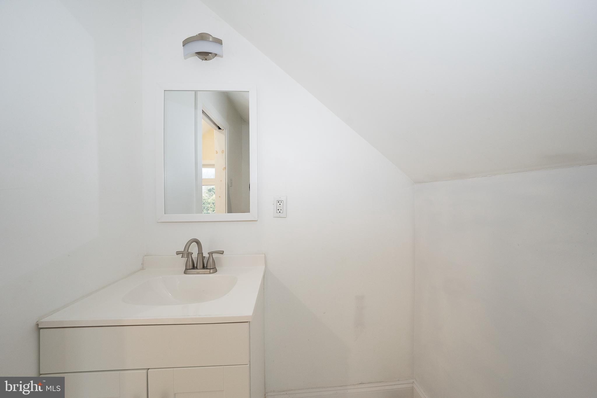 622 Spring Avenue Elkins Park, PA 19027 - Photo 49 of 65 a bathroom with a sink and mirror