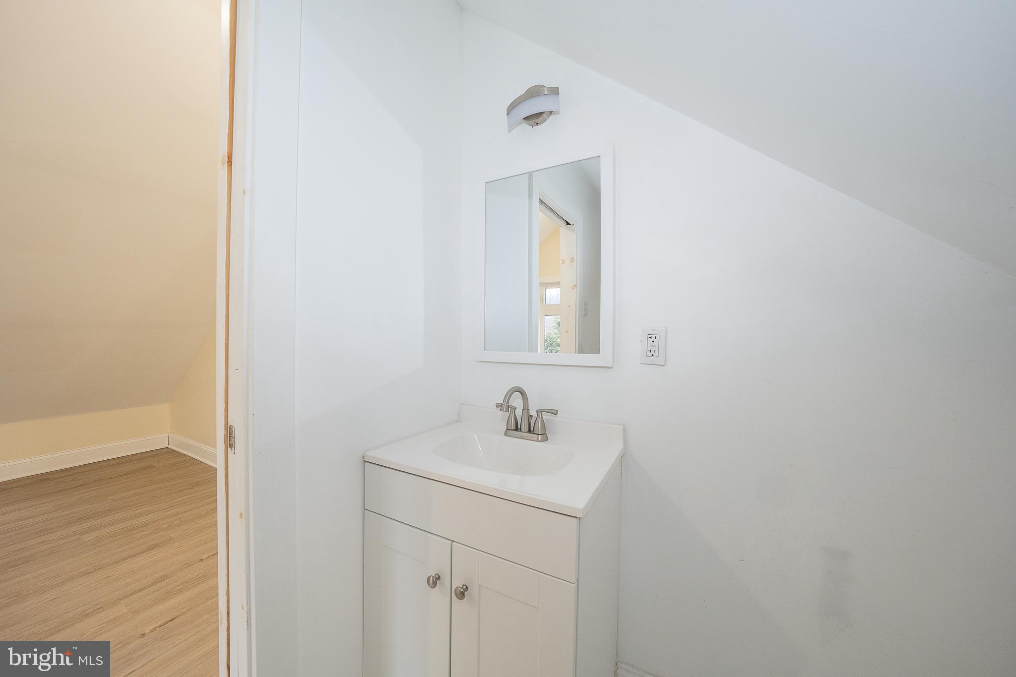 622 Spring Avenue Elkins Park, PA 19027 - Photo 50 of 65 a bathroom with a sink and a mirror