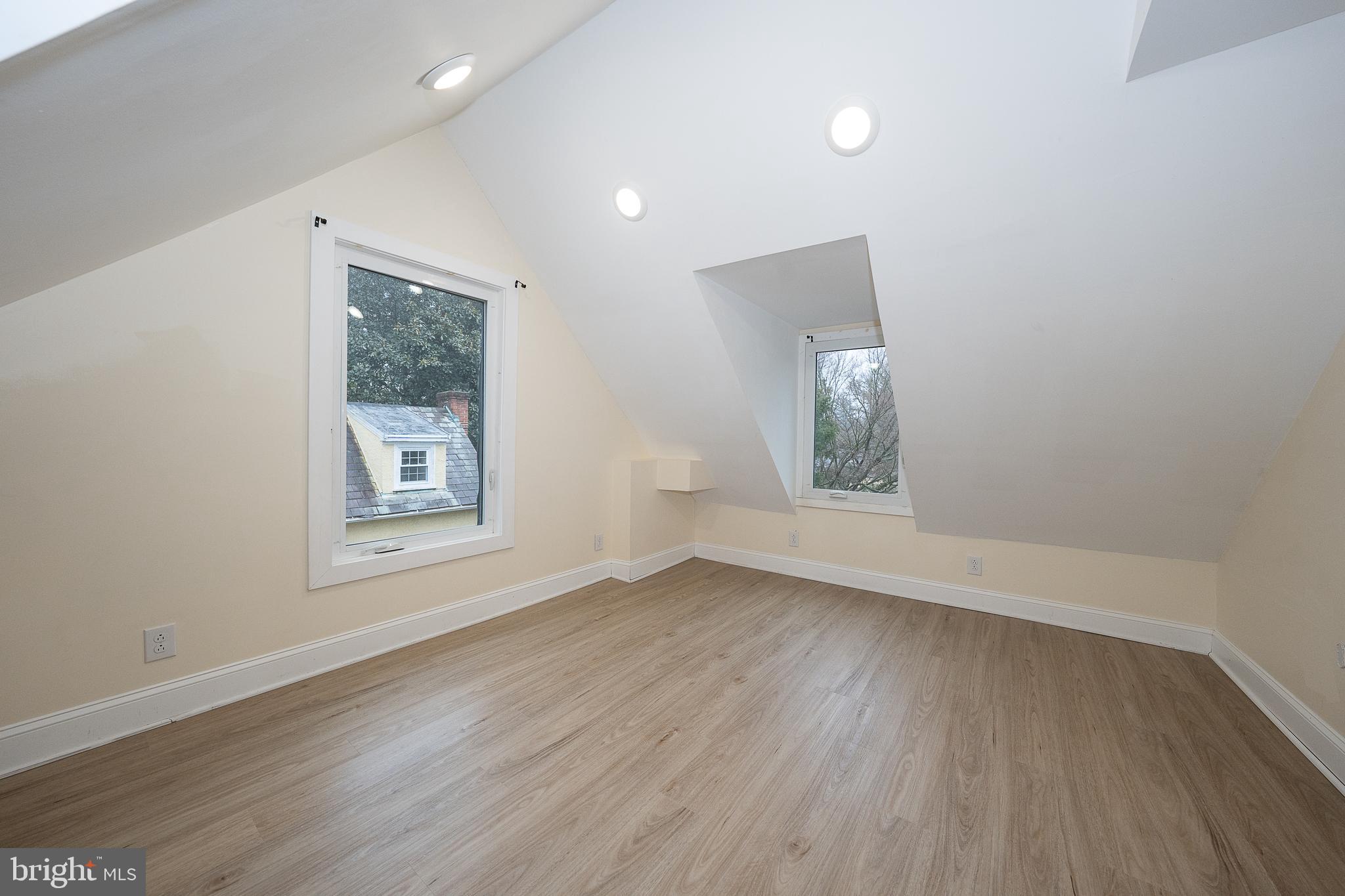 622 Spring Avenue Elkins Park, PA 19027 - Photo 51 of 65 an empty room with wooden floor and windows