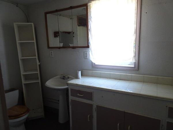 847 Gilman Road Medford, OR 97504 - Photo 4 of 12 a bathroom with a sink a toilet and mirror
