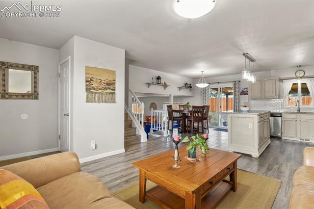 5160 Victory Road Colorado Springs, CO 80911 - Photo 6 of 31 Open concept living featuring the main level living room, kitchen and dining area