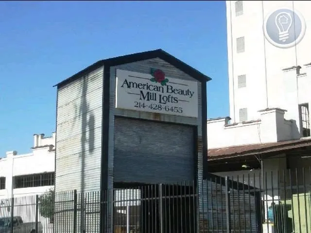 a kitchen with a refrigerator sink and cabinets