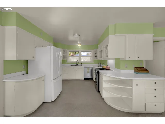 a kitchen with refrigerator and cabinets