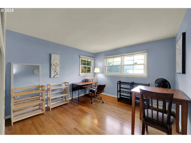 a workspace with furniture window and wooden floor