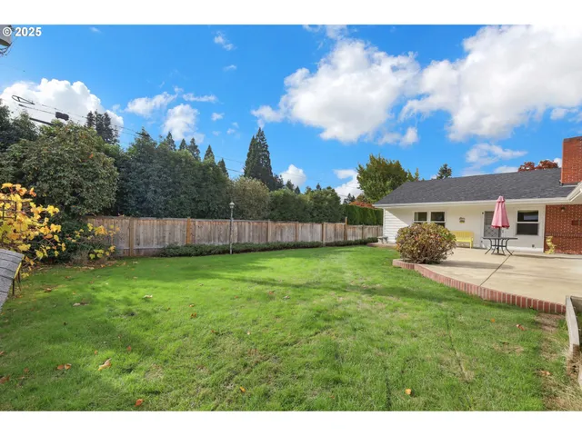 a house view with a sitting space and garden
