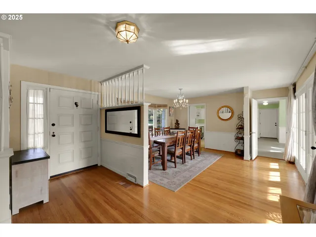a view of a livingroom with furniture and a workspace