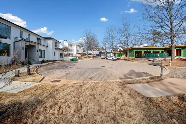 a view of a dirt road with a building