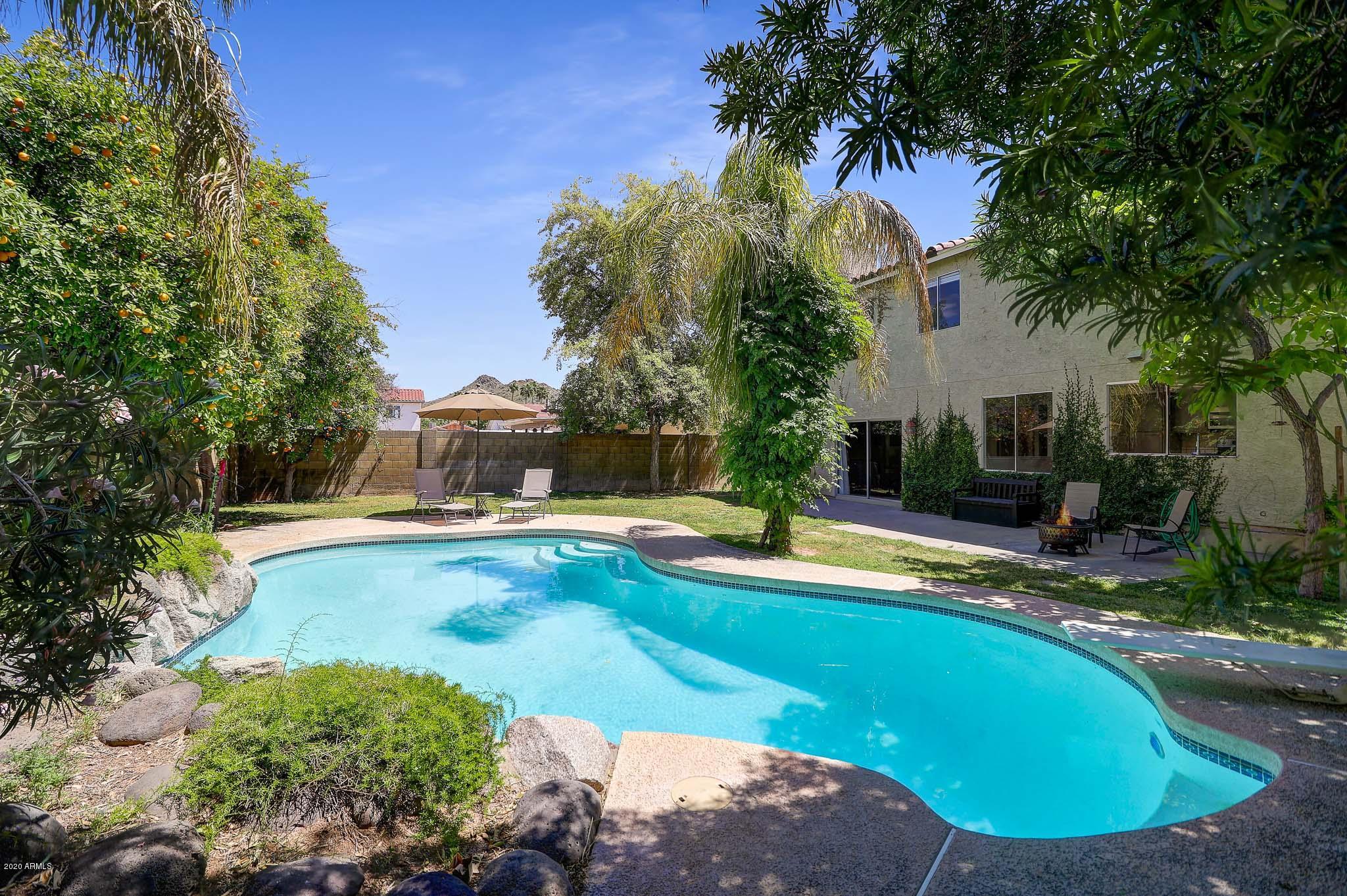 1902 East Redfield Road Phoenix, AZ 85022 - Photo 1 of 31 a view of a swimming pool with a patio