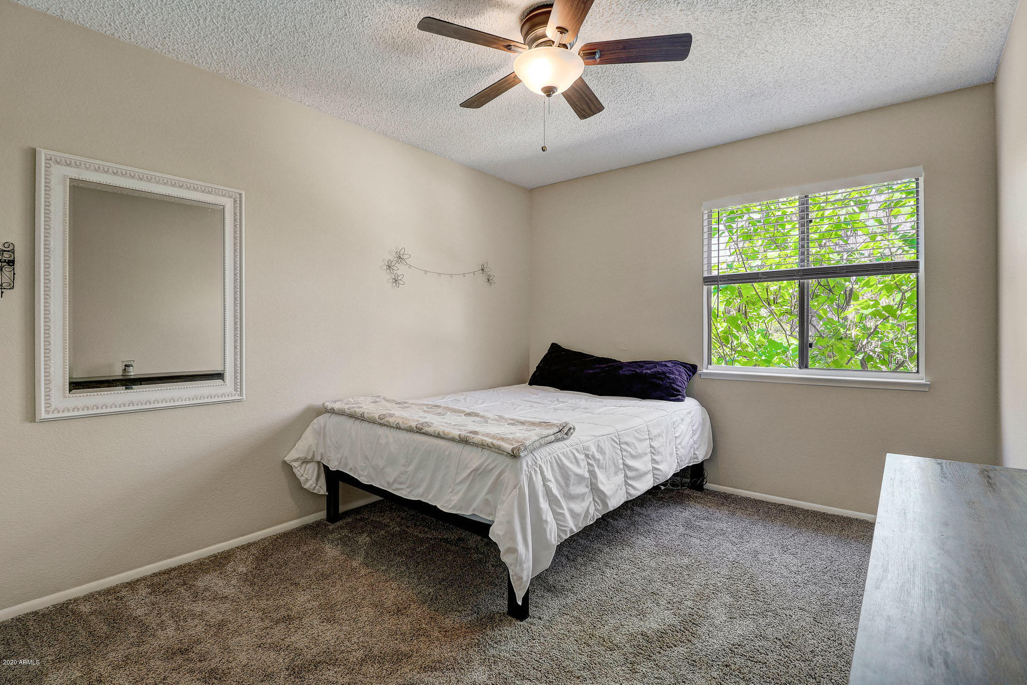 1902 East Redfield Road Phoenix, AZ 85022 - Photo 14 of 31 a bedroom with a bed and a window