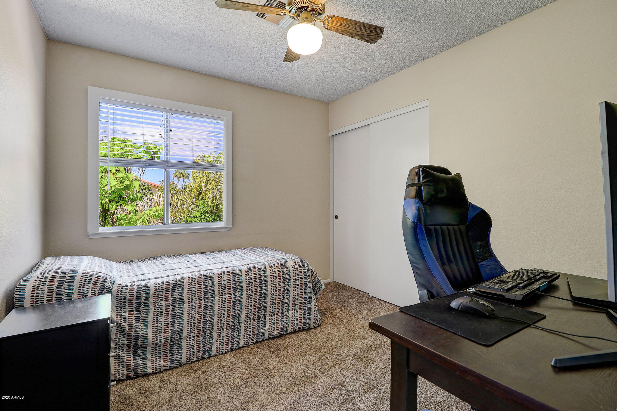 1902 East Redfield Road Phoenix, AZ 85022 - Photo 15 of 31 a bedroom with bed and a window