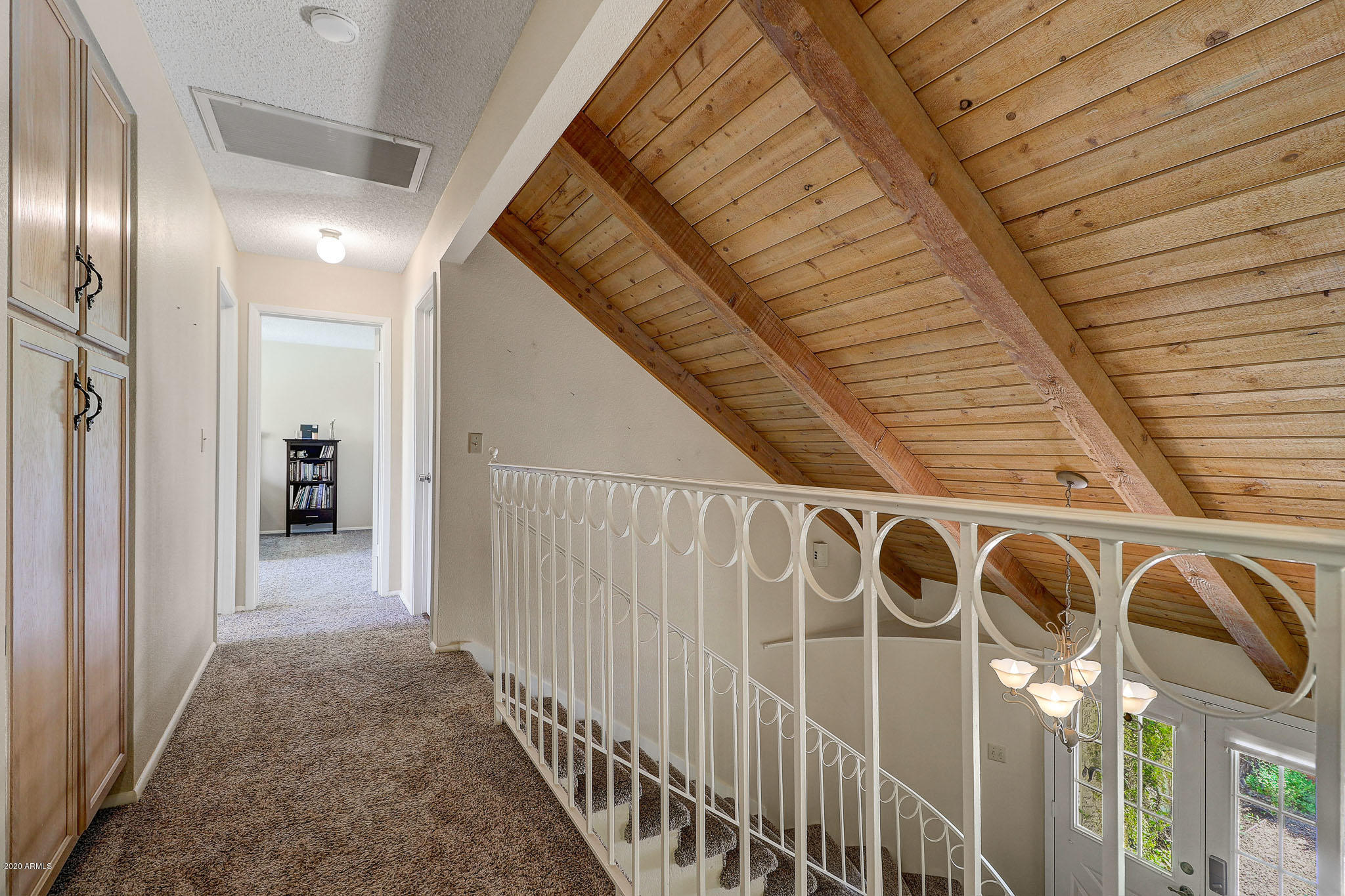 1902 East Redfield Road Phoenix, AZ 85022 - Photo 18 of 31 a view of a hallway with wooden stairs