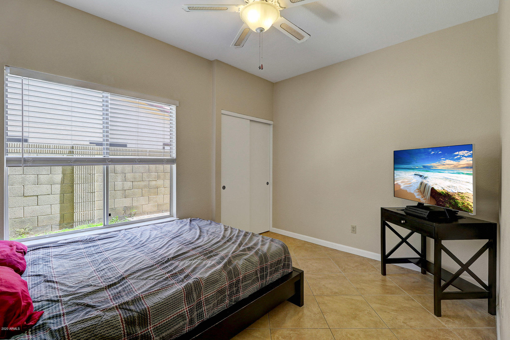 1902 East Redfield Road Phoenix, AZ 85022 - Photo 19 of 31 a bedroom with a bed and a window