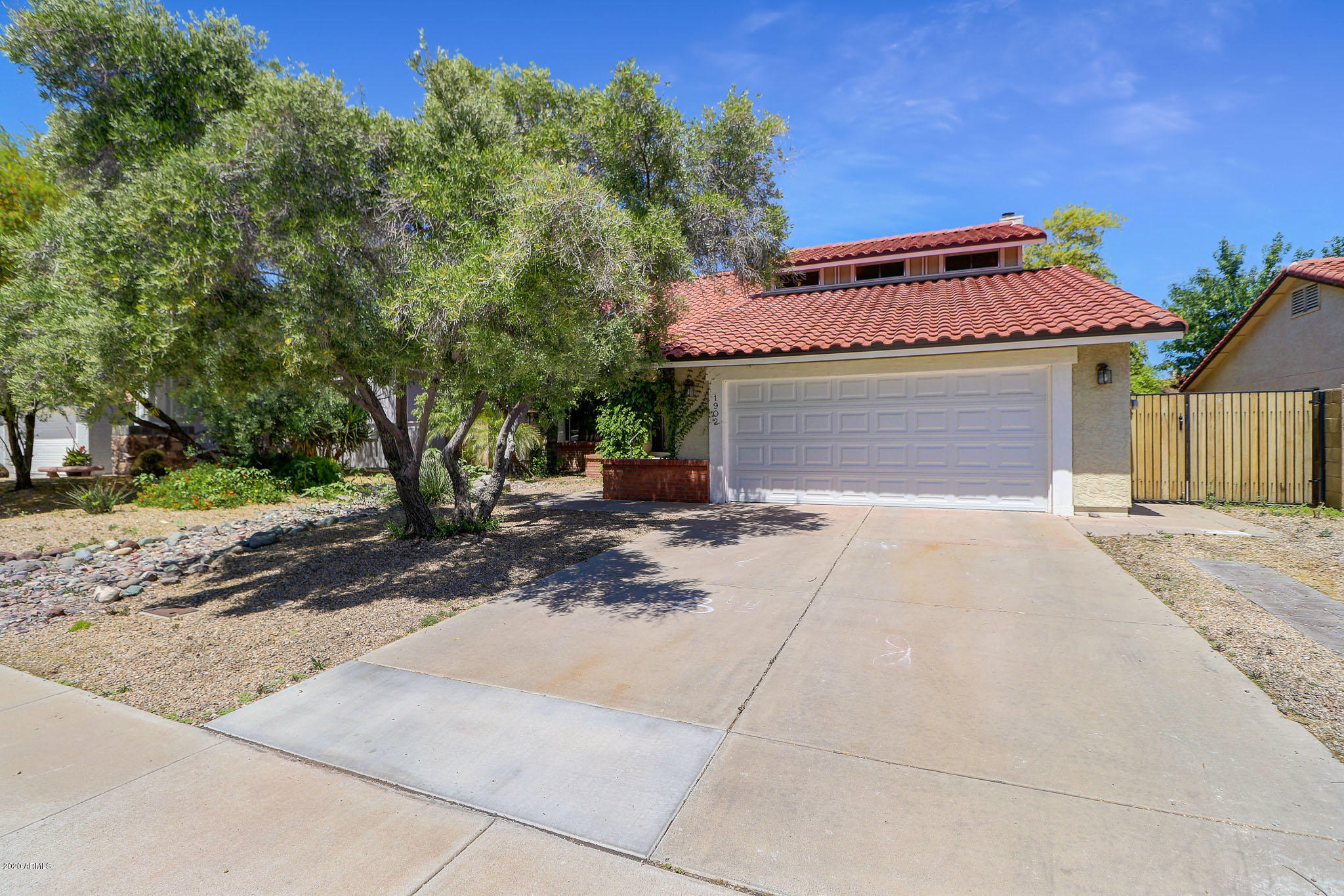 1902 East Redfield Road Phoenix, AZ 85022 - Photo 30 of 31 a front view of a house with a yard and a garage