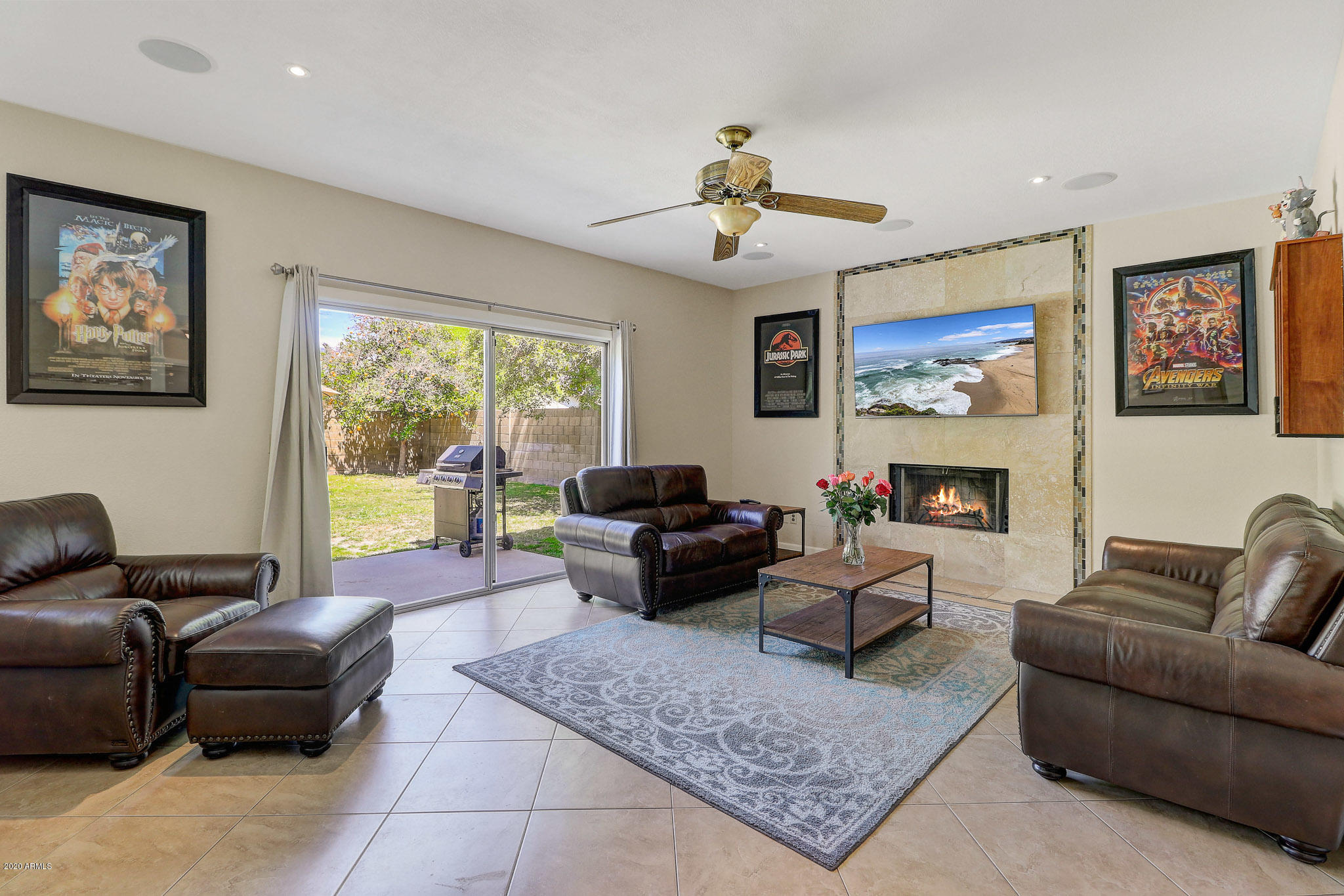 1902 East Redfield Road Phoenix, AZ 85022 - Photo 5 of 31 a living room with furniture two windows and a fireplace