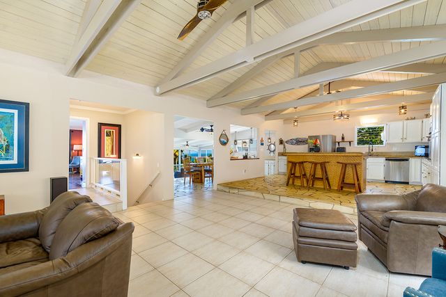 a bathroom with a granite countertop sink mirror vanity and toilet