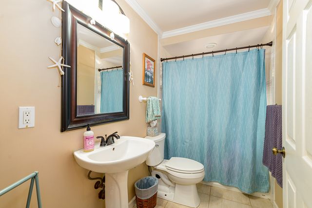 a bedroom with furniture and a potted plant