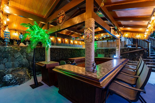 a view of a backyard with sitting area