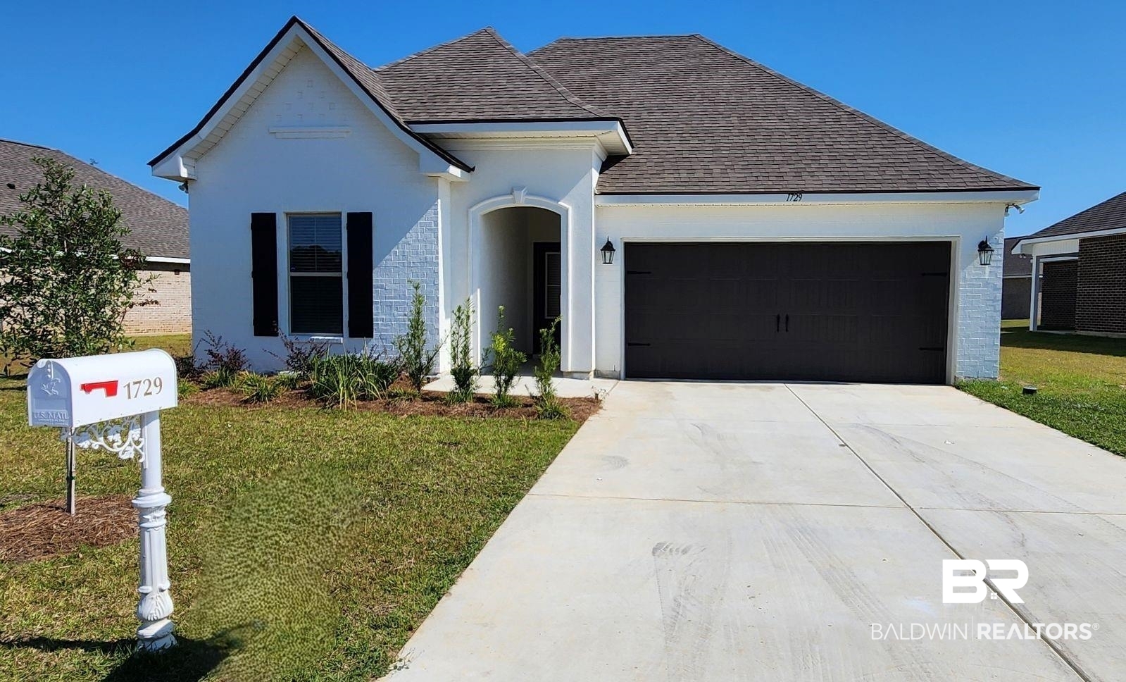 1729 Breckinridge Place Foley, AL 36535 - Photo 1 of 3 View of front of property featuring a front lawn and a garage