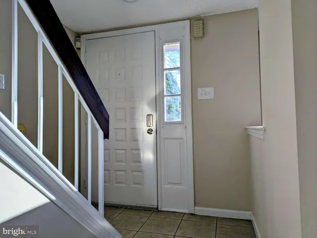 a view of an entryway with staircase