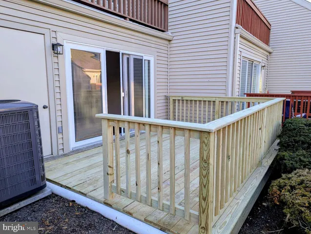 a view of a wooden house with a large window
