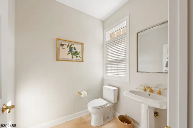 a bedroom with furniture and a large window