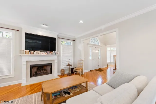 a living room with furniture fireplace and a flat screen tv