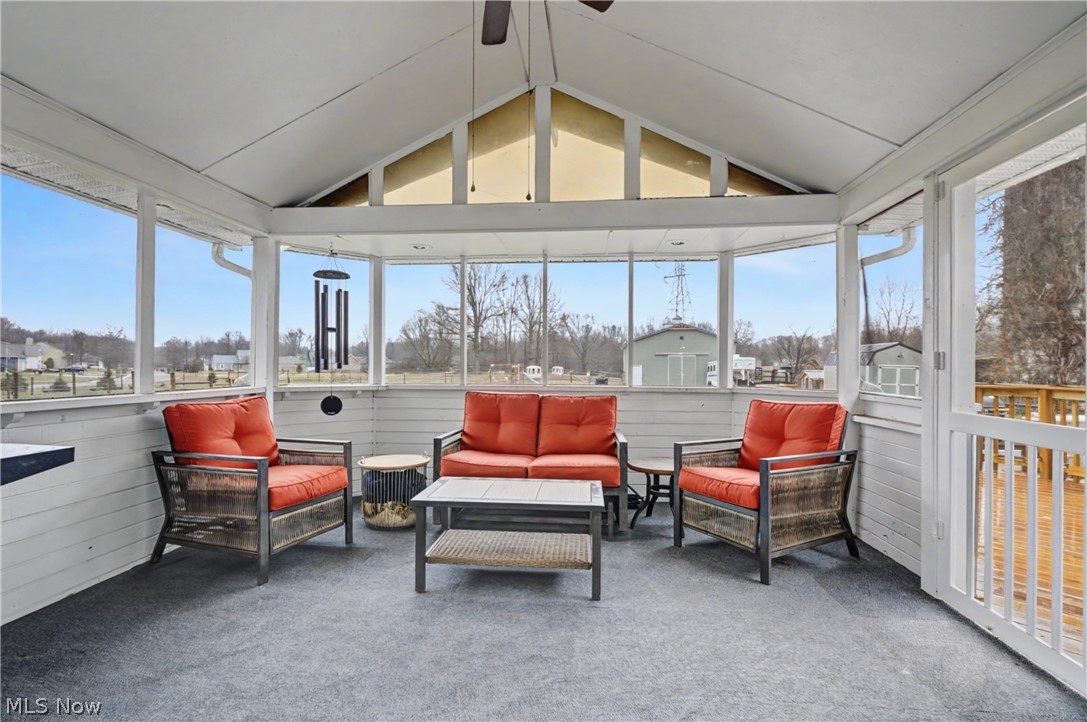 4556 Rootstown Road Ravenna, OH 44266 - Photo 17 of 50 Sunroom / solarium with ceiling fan and outdoor lounge area