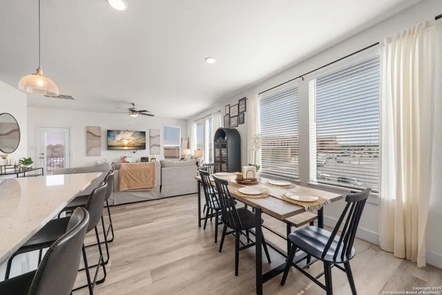 a view of a dining room with furniture and wooden floor