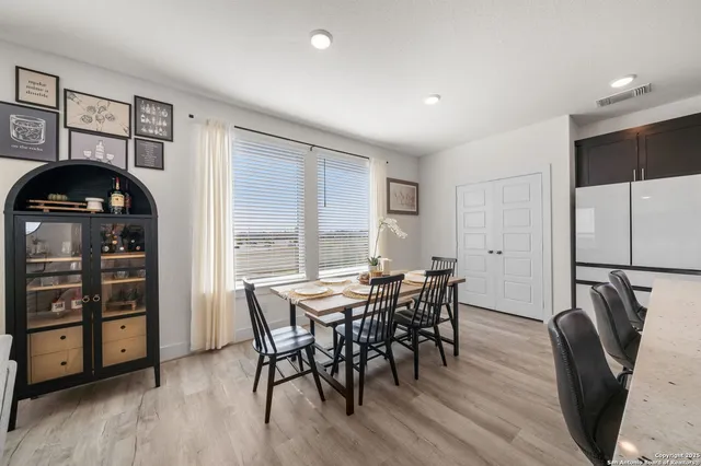 a spacious bedroom with a bed and a flat screen tv