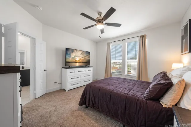 a spacious bathroom with a double vanity sink mirror and double