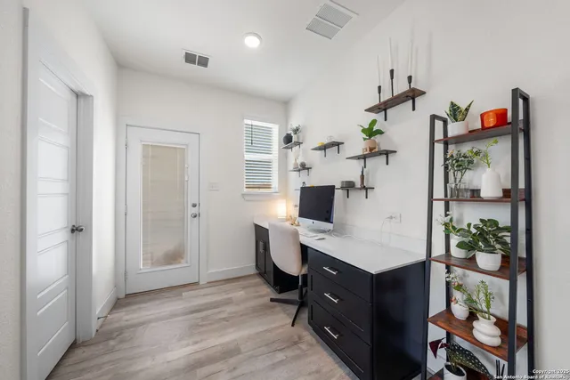 a room with furniture and a wooden floor