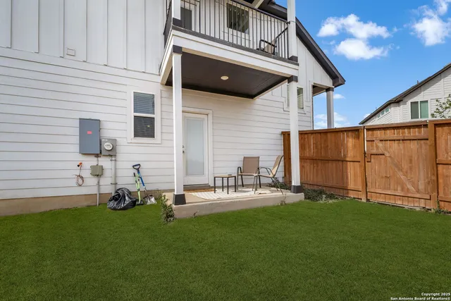 a view of a backyard with potted plants