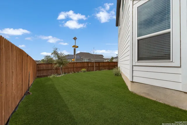 a backyard of a house with lots of green space