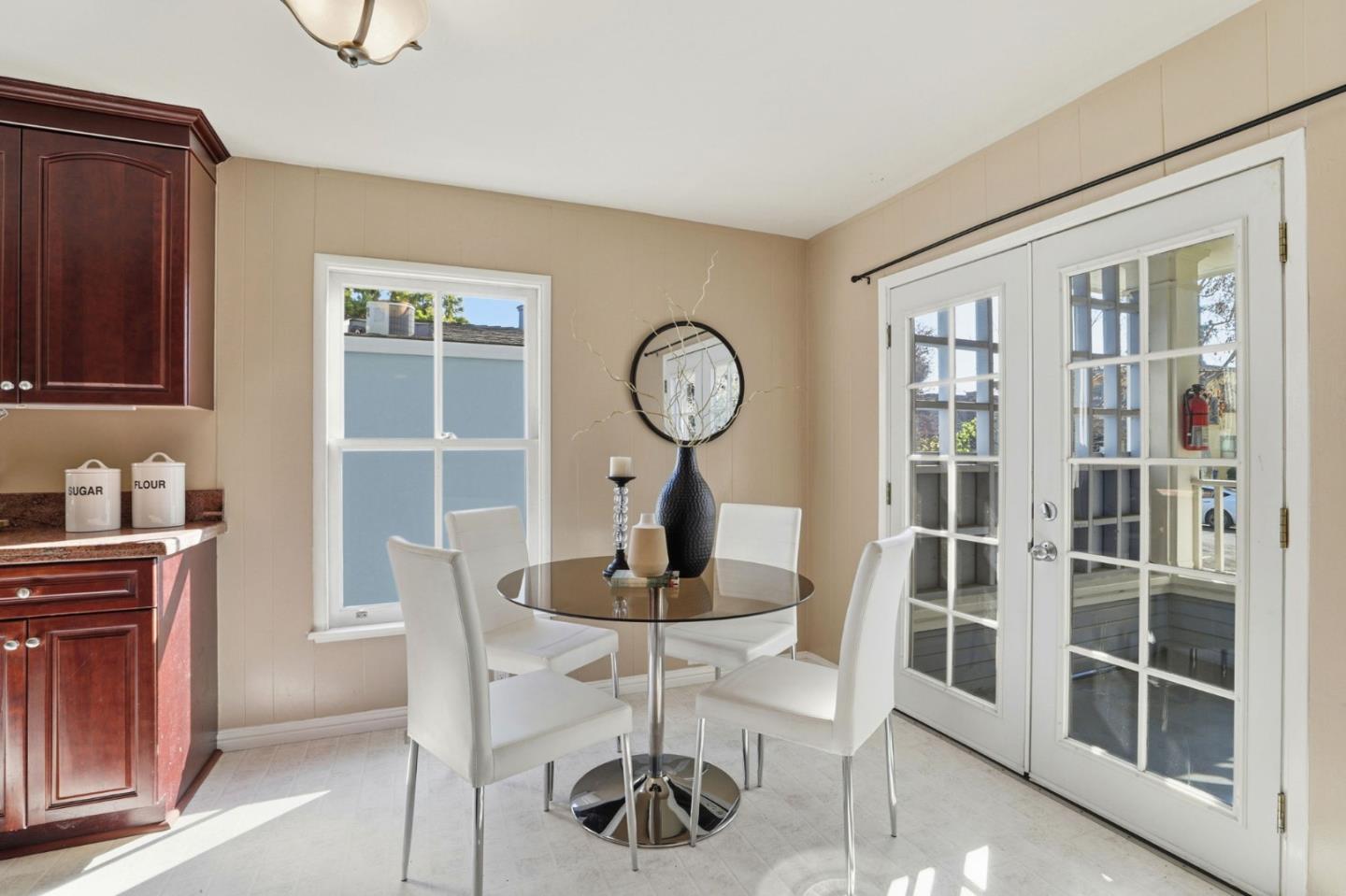 813 Cowper Street Palo Alto, CA 94301 - Photo 11 of 25 a view of a dining room with furniture and a window