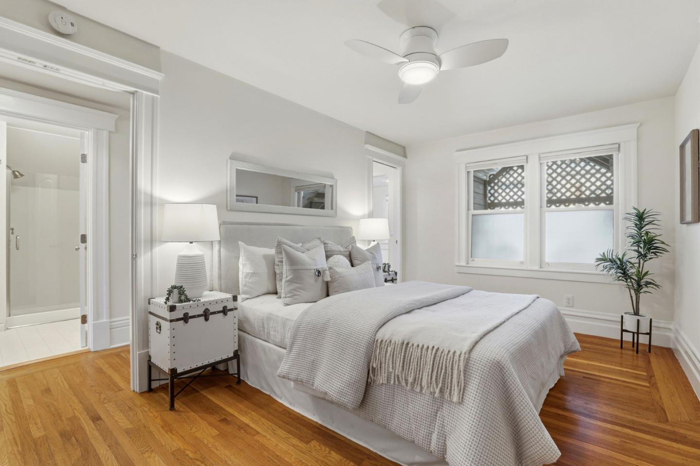 813 Cowper Street Palo Alto, CA 94301 - Photo 13 of 25 a bedroom with a bed and a chandelier