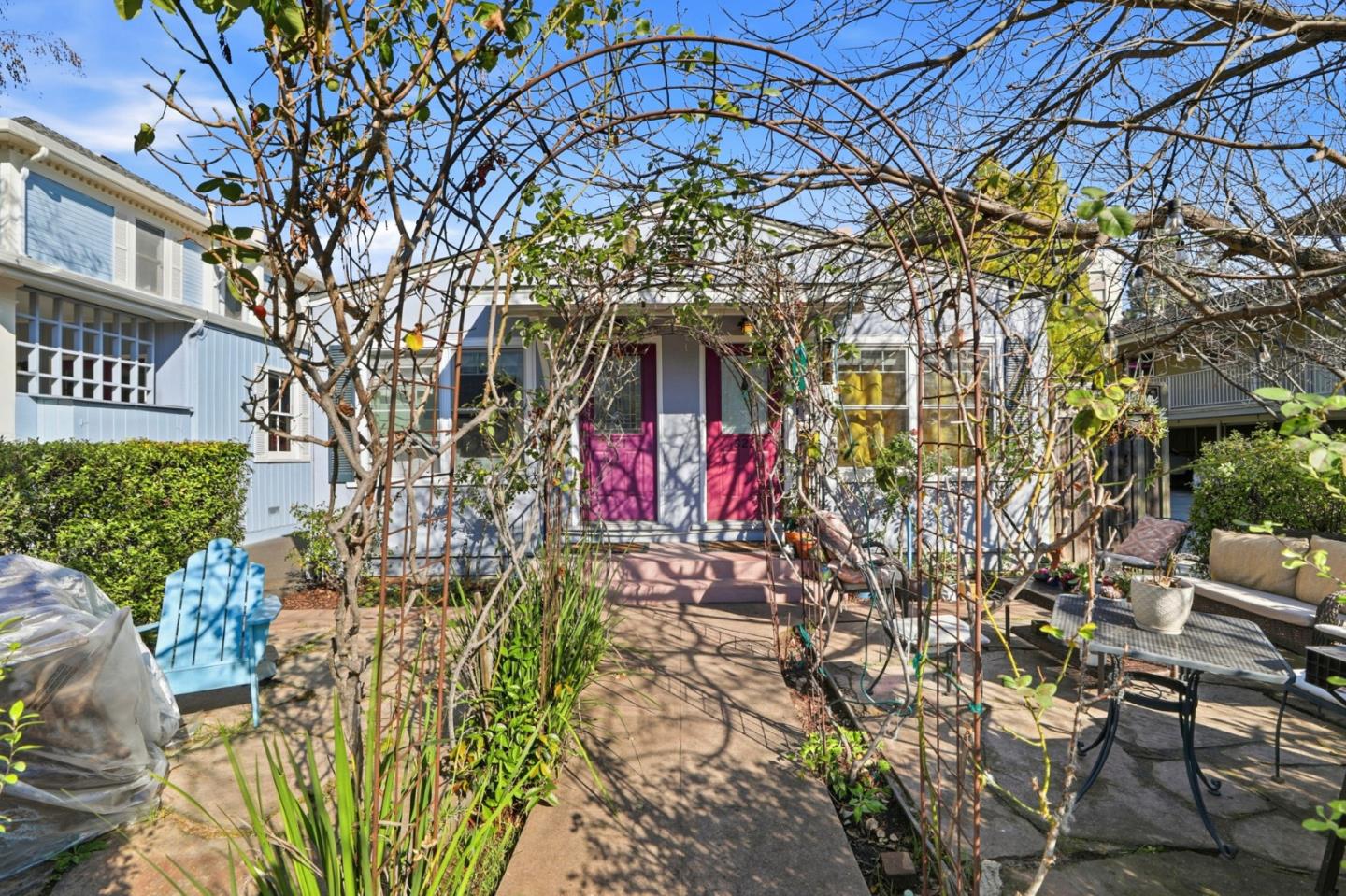 813 Cowper Street Palo Alto, CA 94301 - Photo 16 of 25 a front view of a multi story residential apartment building with yard and sign board