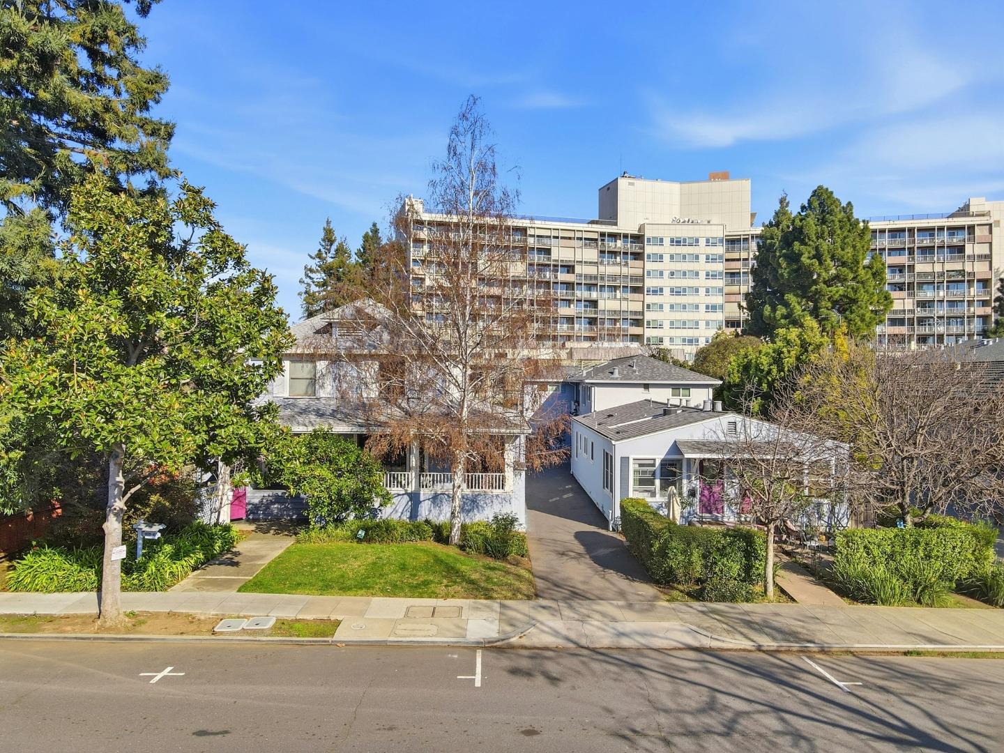 813 Cowper Street Palo Alto, CA 94301 - Photo 22 of 25 a front view of a building with a garden and plants