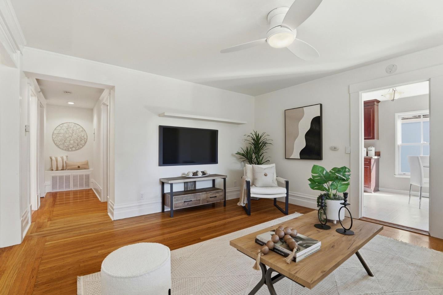 813 Cowper Street Palo Alto, CA 94301 - Photo 9 of 25 a living room with furniture a rug and a flat screen tv
