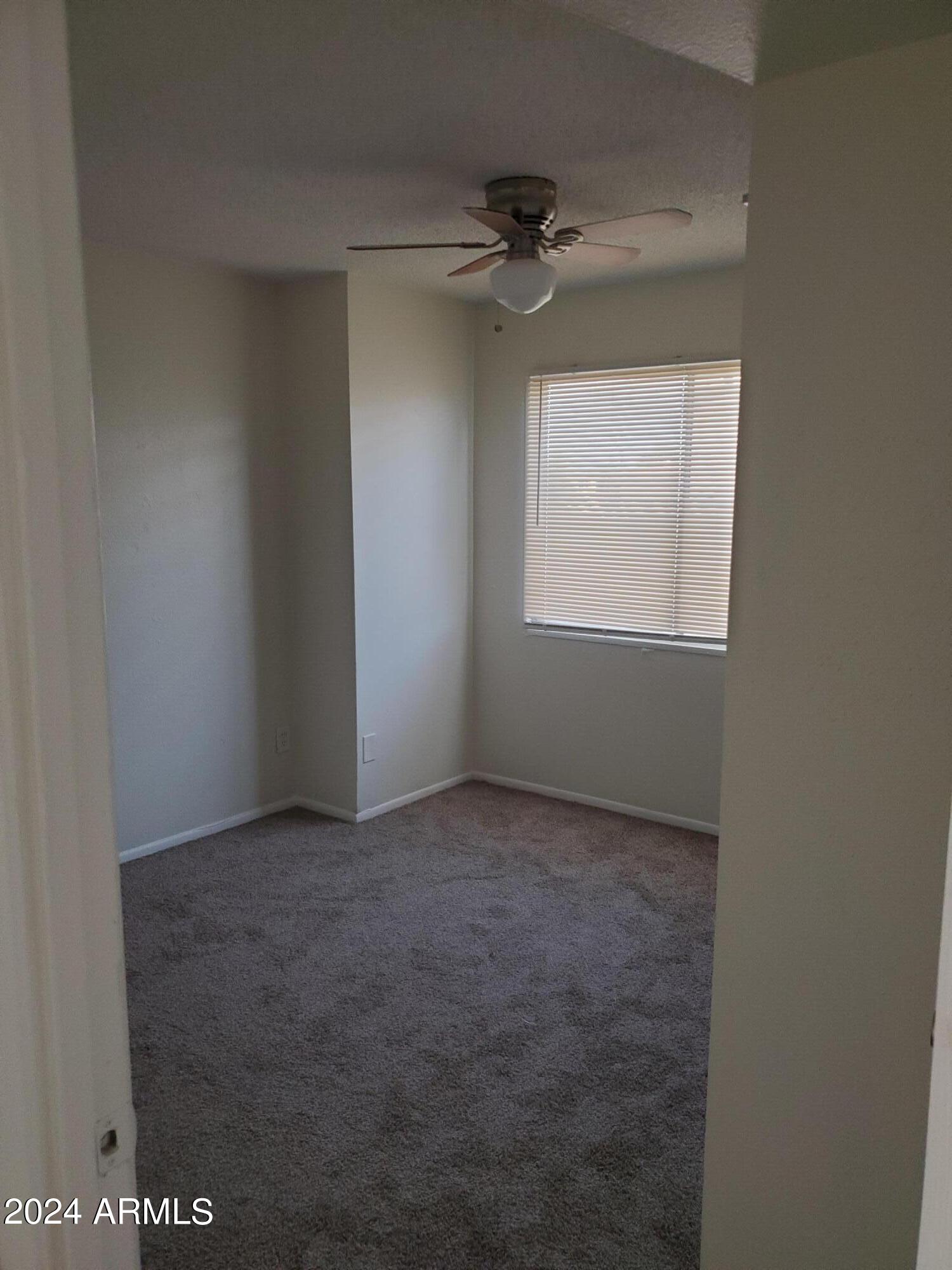 4010 West Wonderview Road Phoenix, AZ 85019 - Photo 9 of 9 an empty room with a window