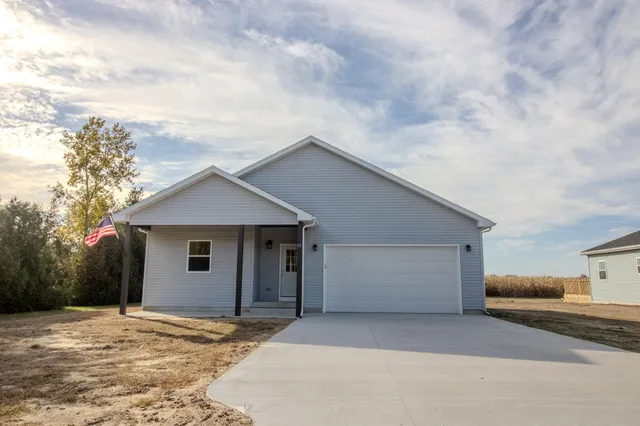 a house with yard in front of it