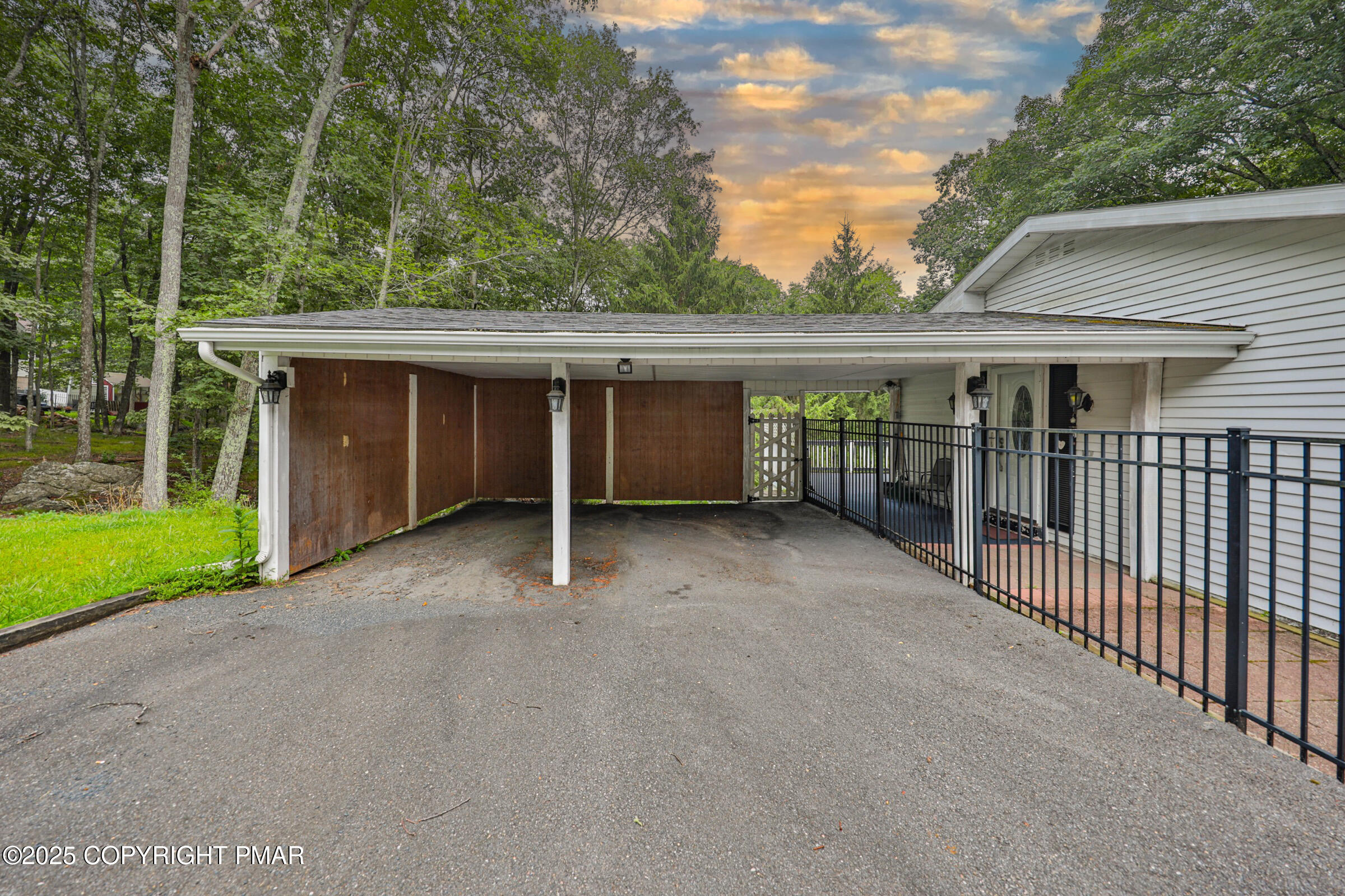 1094 Maple Lake Drive Bushkill, PA 18324 - Photo 12 of 81 a view of a house with a backyard and floor to ceiling window