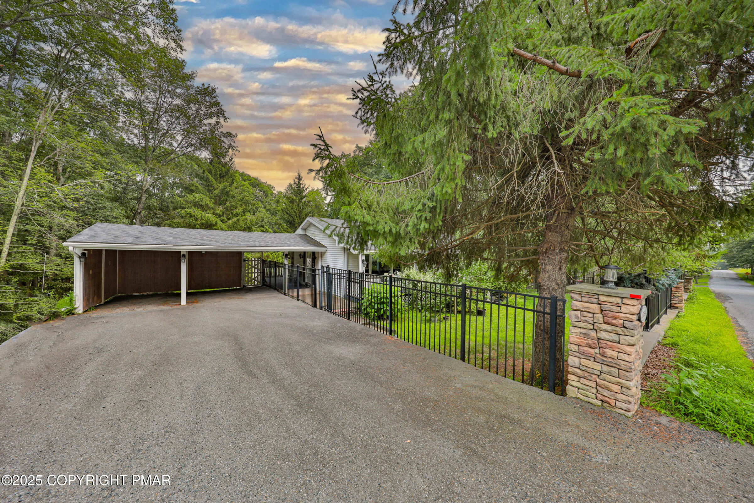 1094 Maple Lake Drive Bushkill, PA 18324 - Photo 13 of 81 a view of a house with backyard and trees